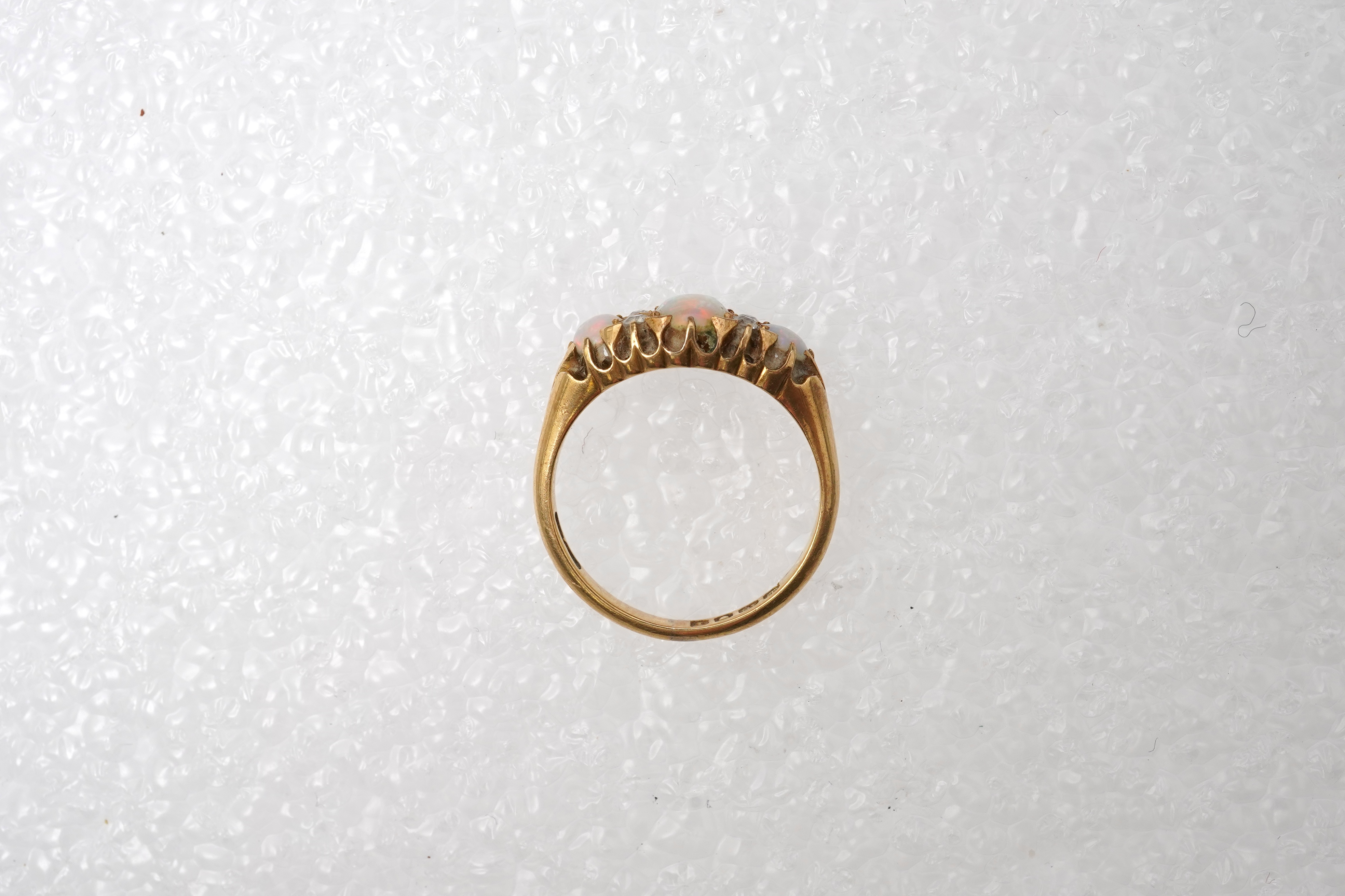 An Edwardian opal and diamond ring, circa 1904